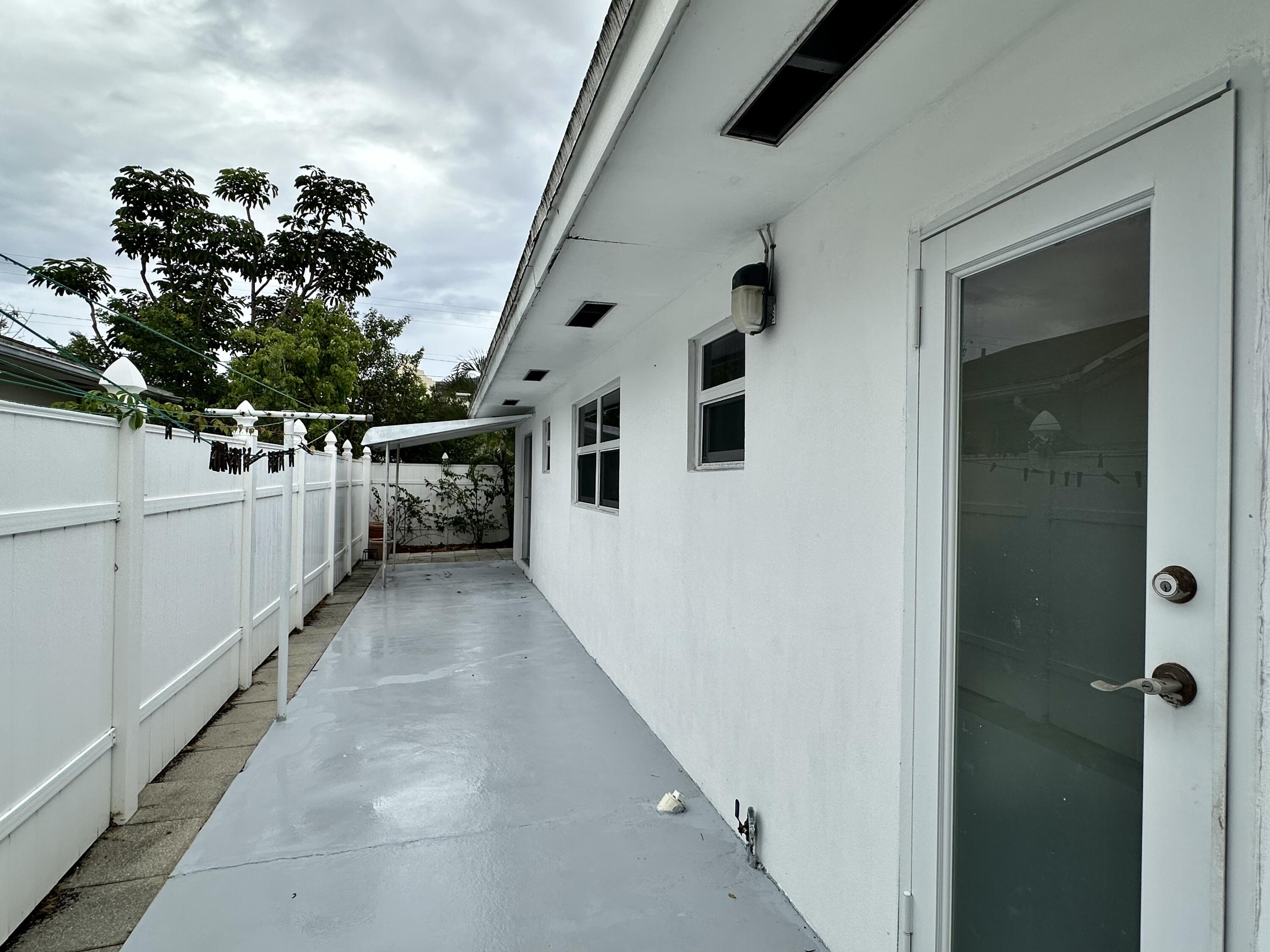 728 Ridge Road, Unit 35 Lantana, FL 33462 - Photo 24 of 35 a view of a house with a backyard