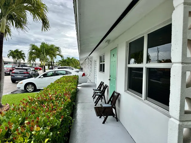 a view of a chair and tables in patio of the house