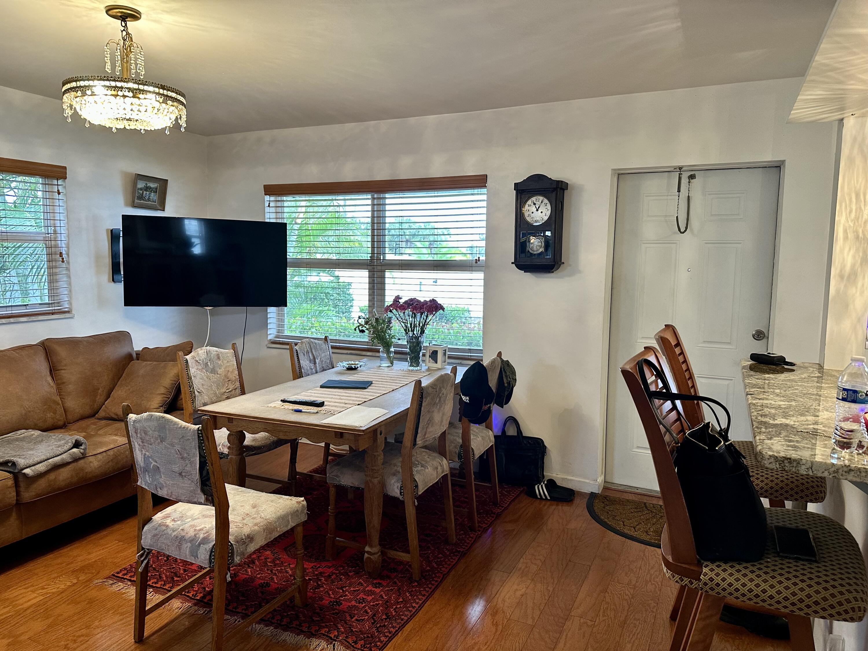 728 Ridge Road, Unit 35 Lantana, FL 33462 - Photo 4 of 35 a view of a dining room with furniture and a large window