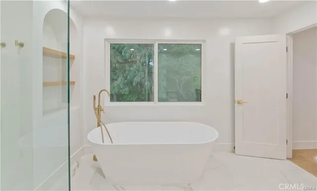 a bathroom with a granite countertop sink a mirror and a vanity