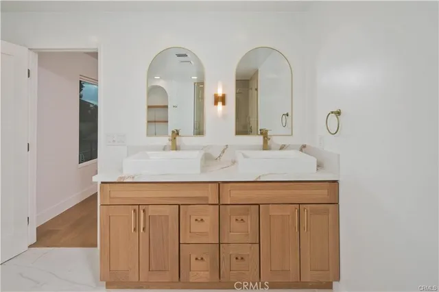 a bathroom with a tub sink and mirror