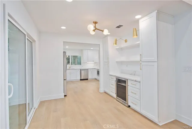 a kitchen with a stove a sink and a microwave