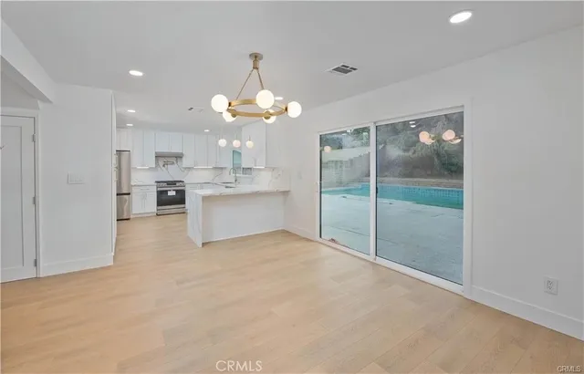 a large kitchen with cabinets
