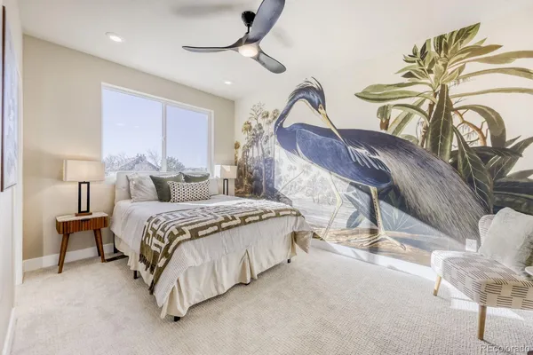 a bedroom with a bed and chandelier