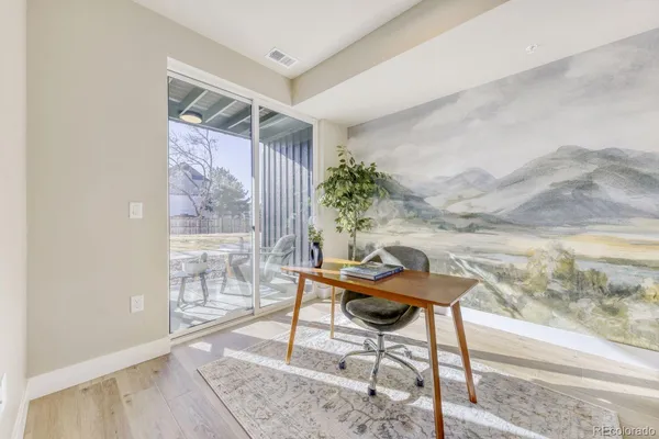 a workspace with furniture and a gate