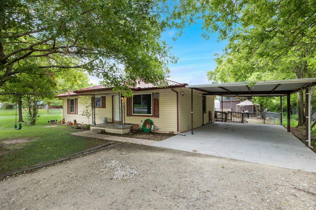 571 South 1st Street Point, TX 75472 - Photo 3 of 27 a view of a house with backyard