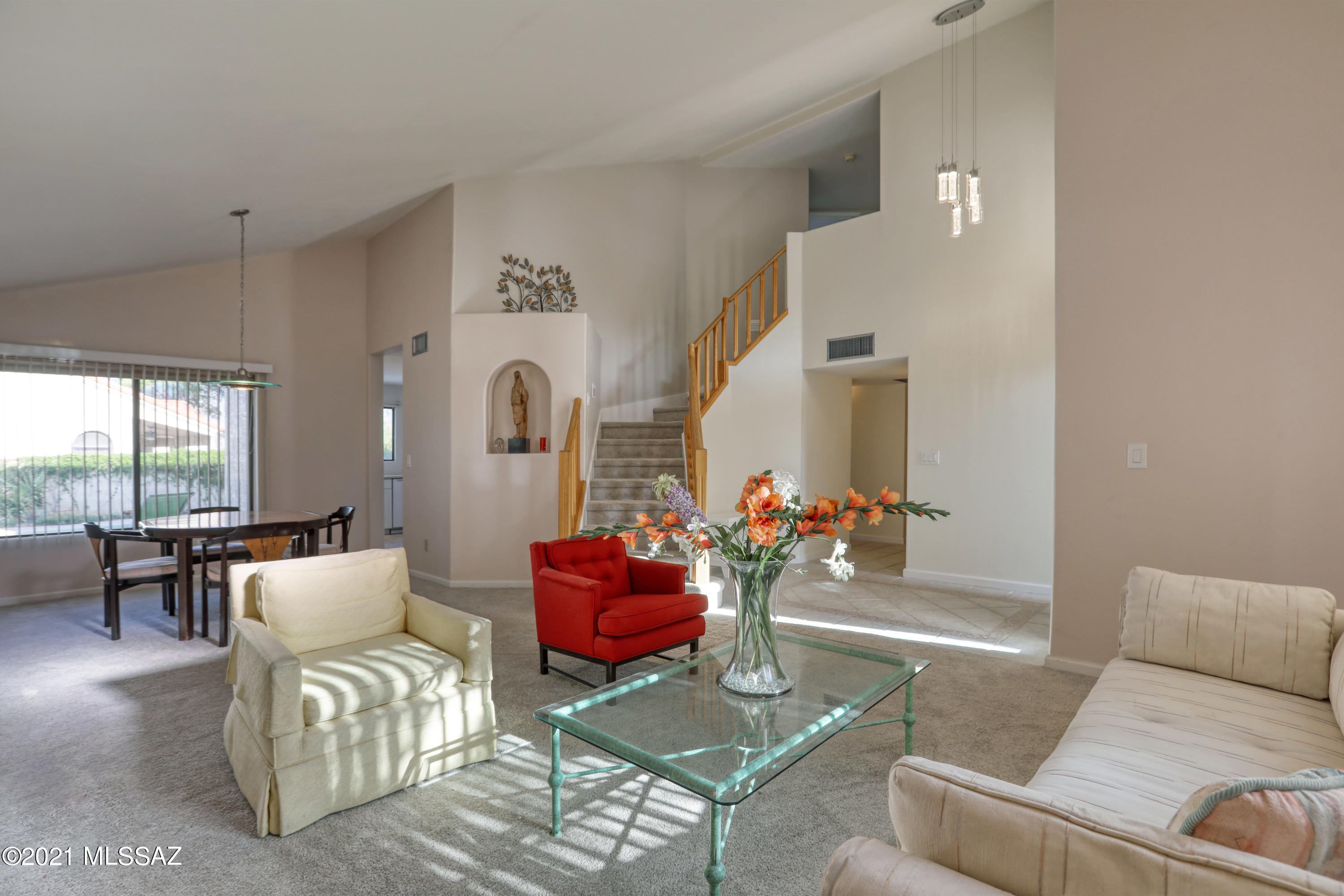 12560 North Wayfarer Way Oro Valley, AZ 85755 - Photo 4 of 43 a living room with furniture and a large window