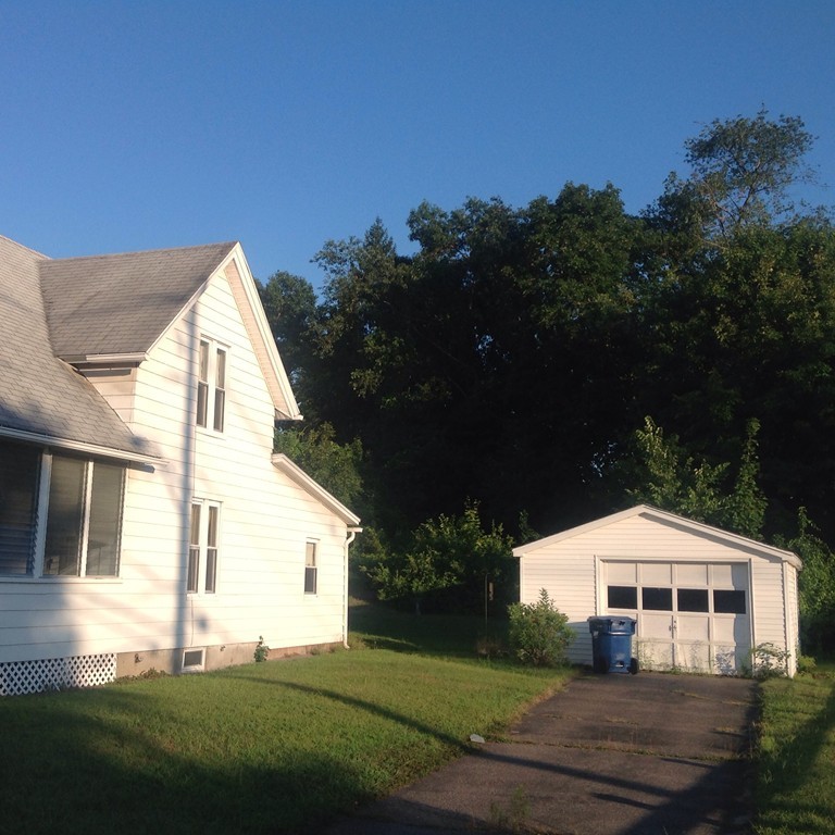 2167 Main Street Three Rivers, MA 01080 - Photo 2 of 6 a front view of a house with a yard