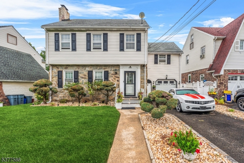 2785 Larchmont Road Union, NJ 07083 - Photo 1 of 15 a front view of a house with garden
