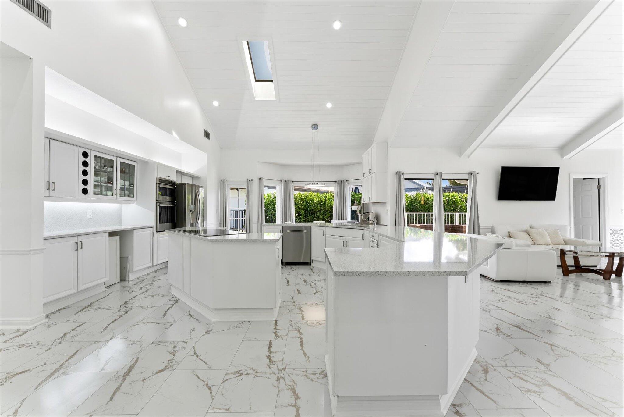 10722 Kirkaldy Lane Boca Raton, FL 33498 - Photo 12 of 76 a living room with furniture and a flat screen tv