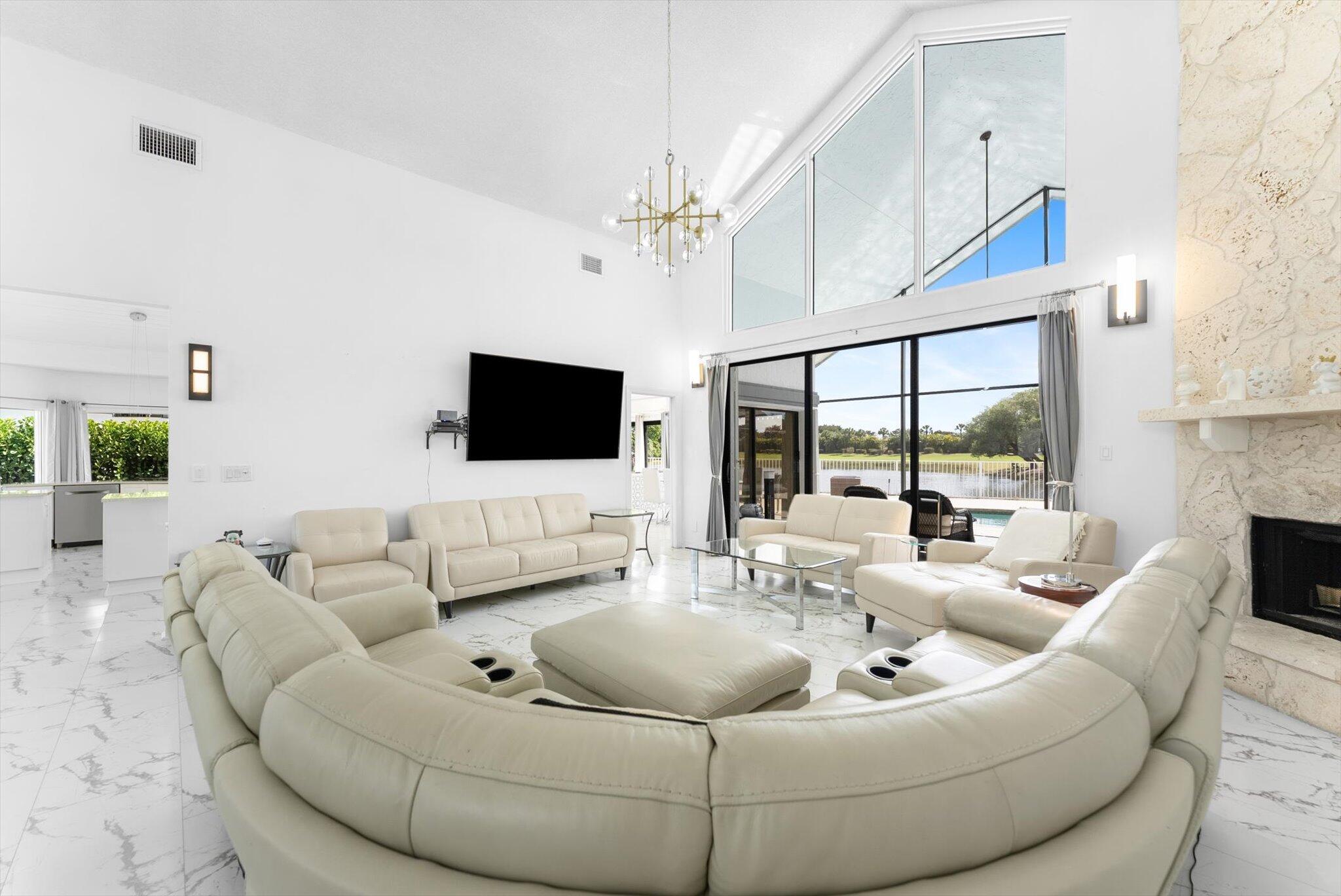 10722 Kirkaldy Lane Boca Raton, FL 33498 - Photo 16 of 76 a living room with furniture and a flat screen tv