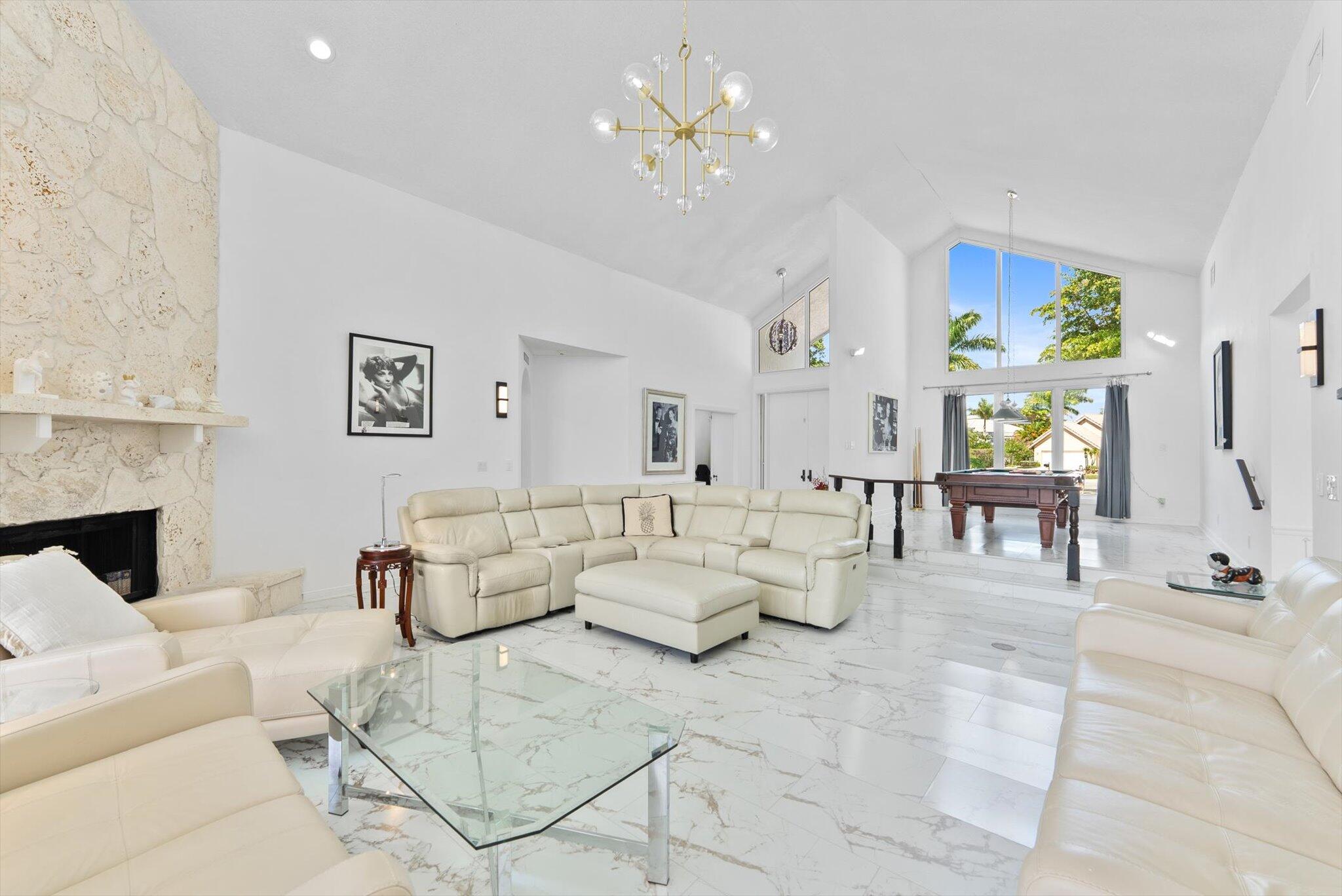 10722 Kirkaldy Lane Boca Raton, FL 33498 - Photo 17 of 76 a living room with furniture and painting on the wall