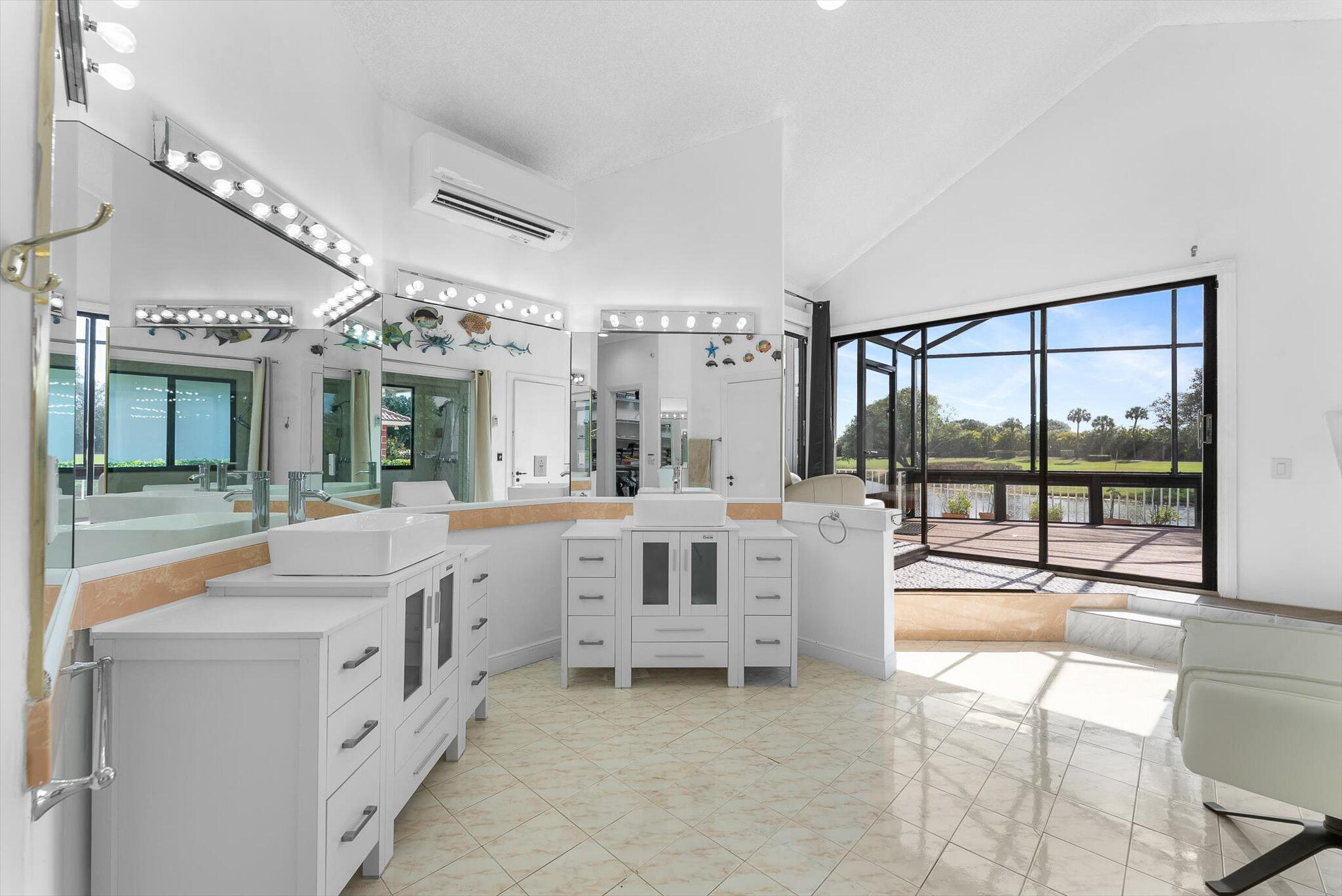 10722 Kirkaldy Lane Boca Raton, FL 33498 - Photo 22 of 76 a bathroom with a sink and a large mirror