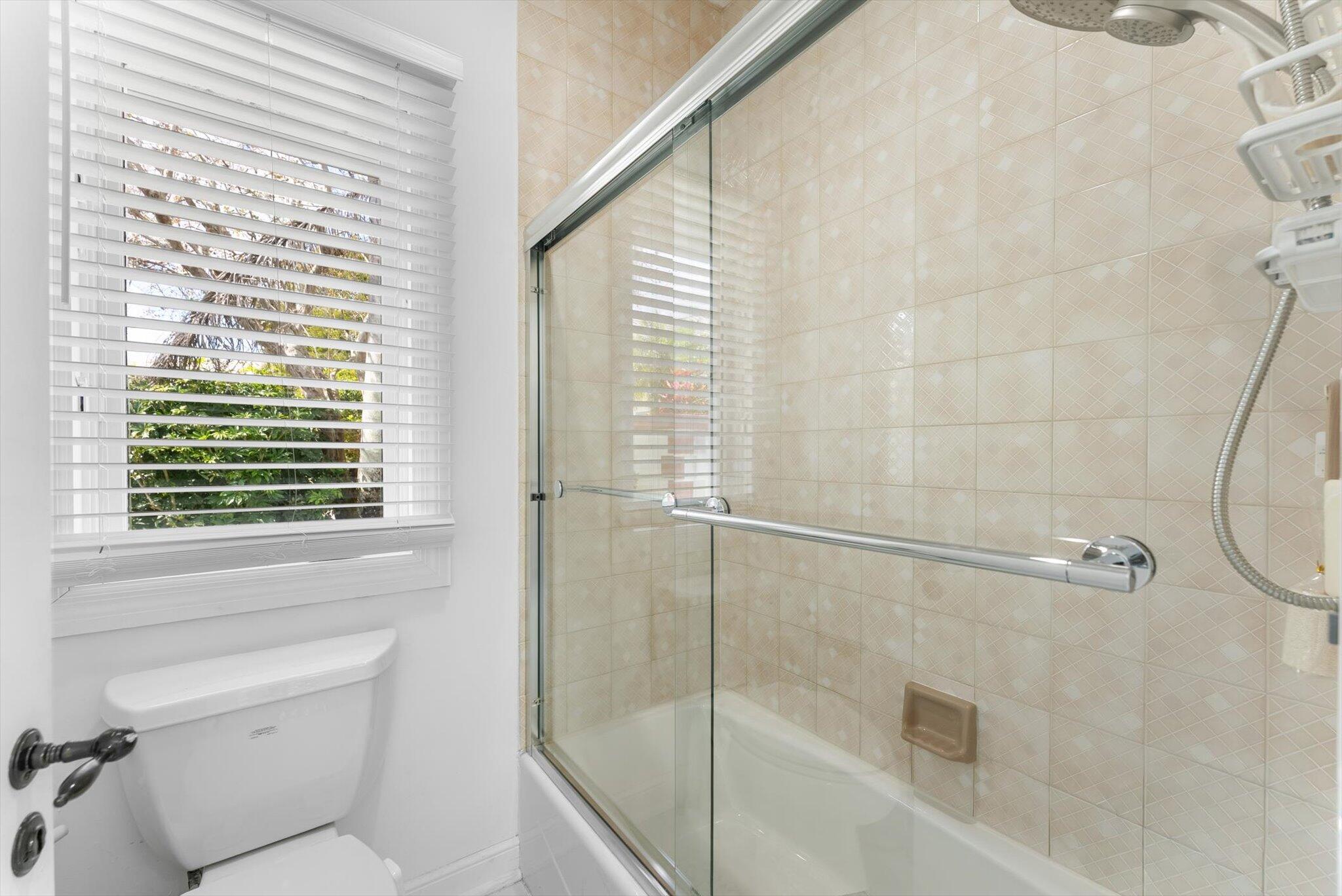 10722 Kirkaldy Lane Boca Raton, FL 33498 - Photo 28 of 76 a bathroom with a shower and a toilet
