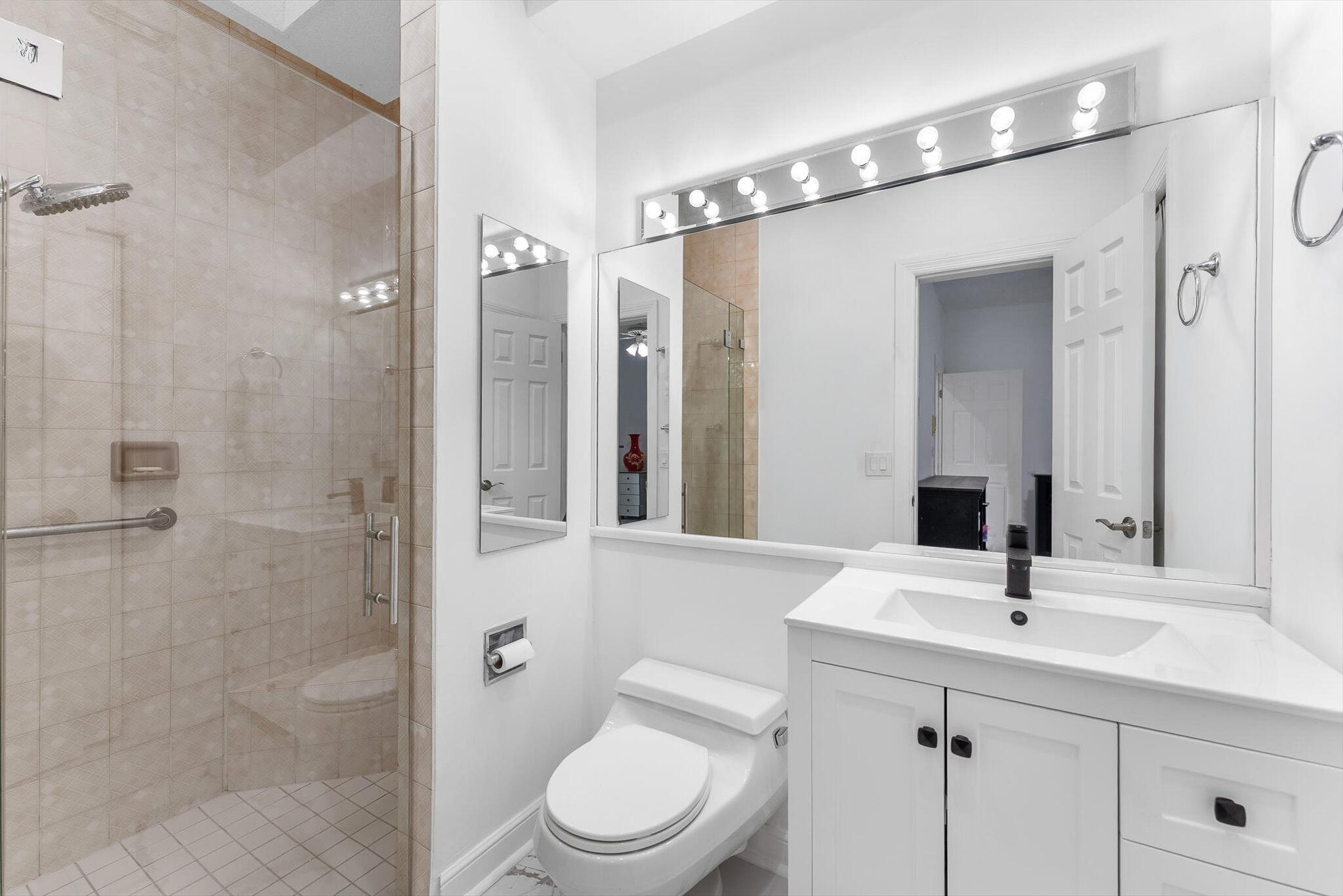 10722 Kirkaldy Lane Boca Raton, FL 33498 - Photo 33 of 76 a bathroom with a sink a toilet a mirror and shower