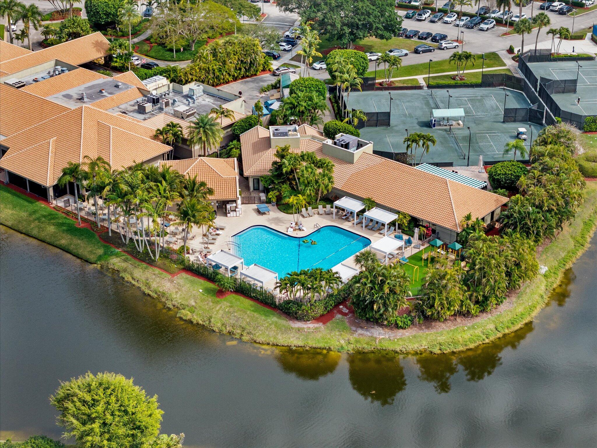 10722 Kirkaldy Lane Boca Raton, FL 33498 - Photo 50 of 76 an aerial view of a house with a garden and lake view