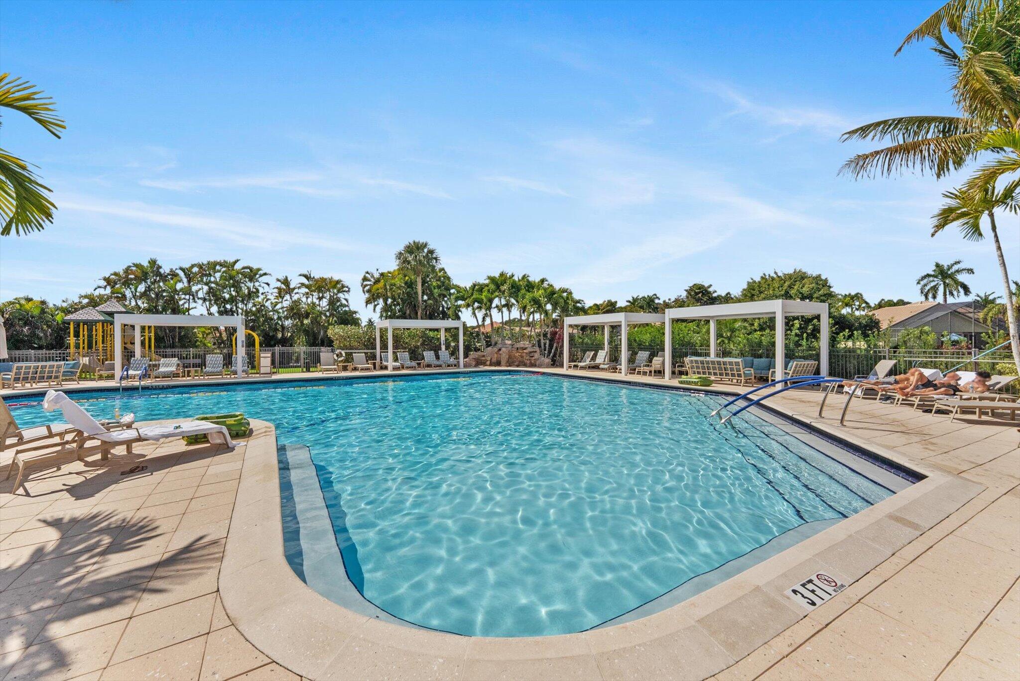10722 Kirkaldy Lane Boca Raton, FL 33498 - Photo 66 of 76 a view of a swimming pool with a yard