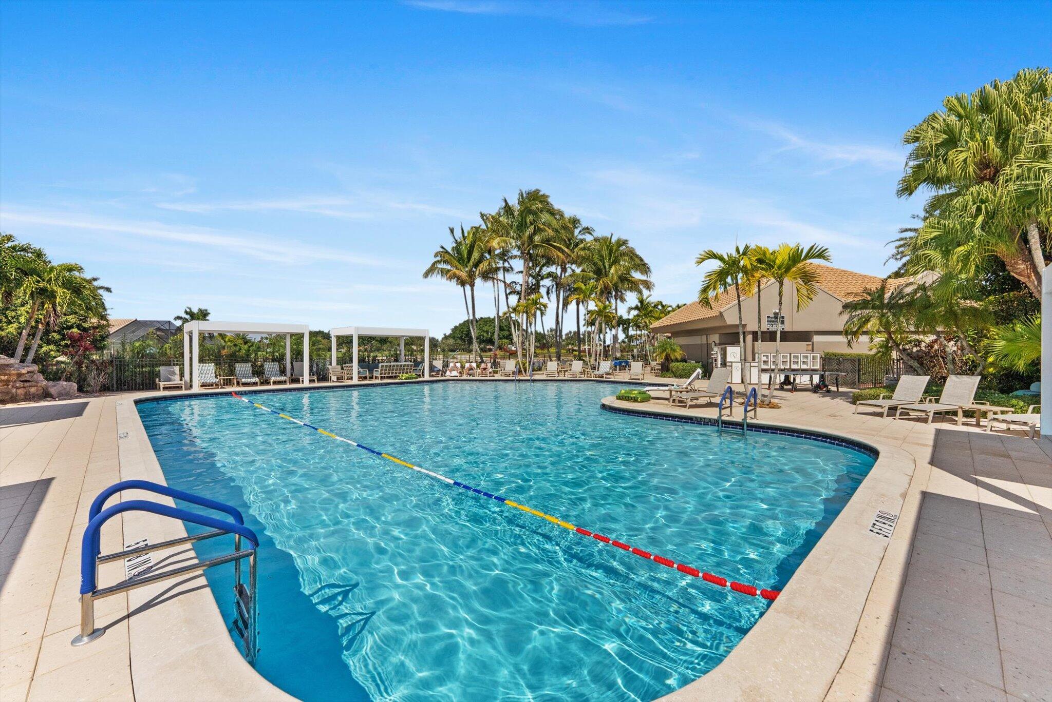 10722 Kirkaldy Lane Boca Raton, FL 33498 - Photo 67 of 76 a view of a swimming pool with a yard