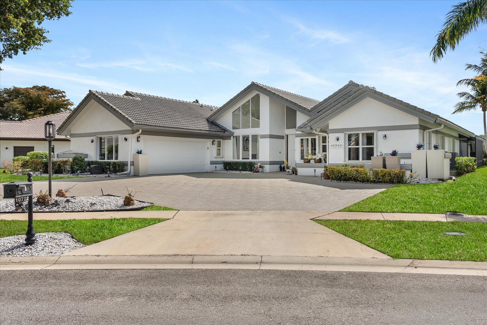 10722 Kirkaldy Lane Boca Raton, FL 33498 - Photo 74 of 76 a front view of a house with a yard