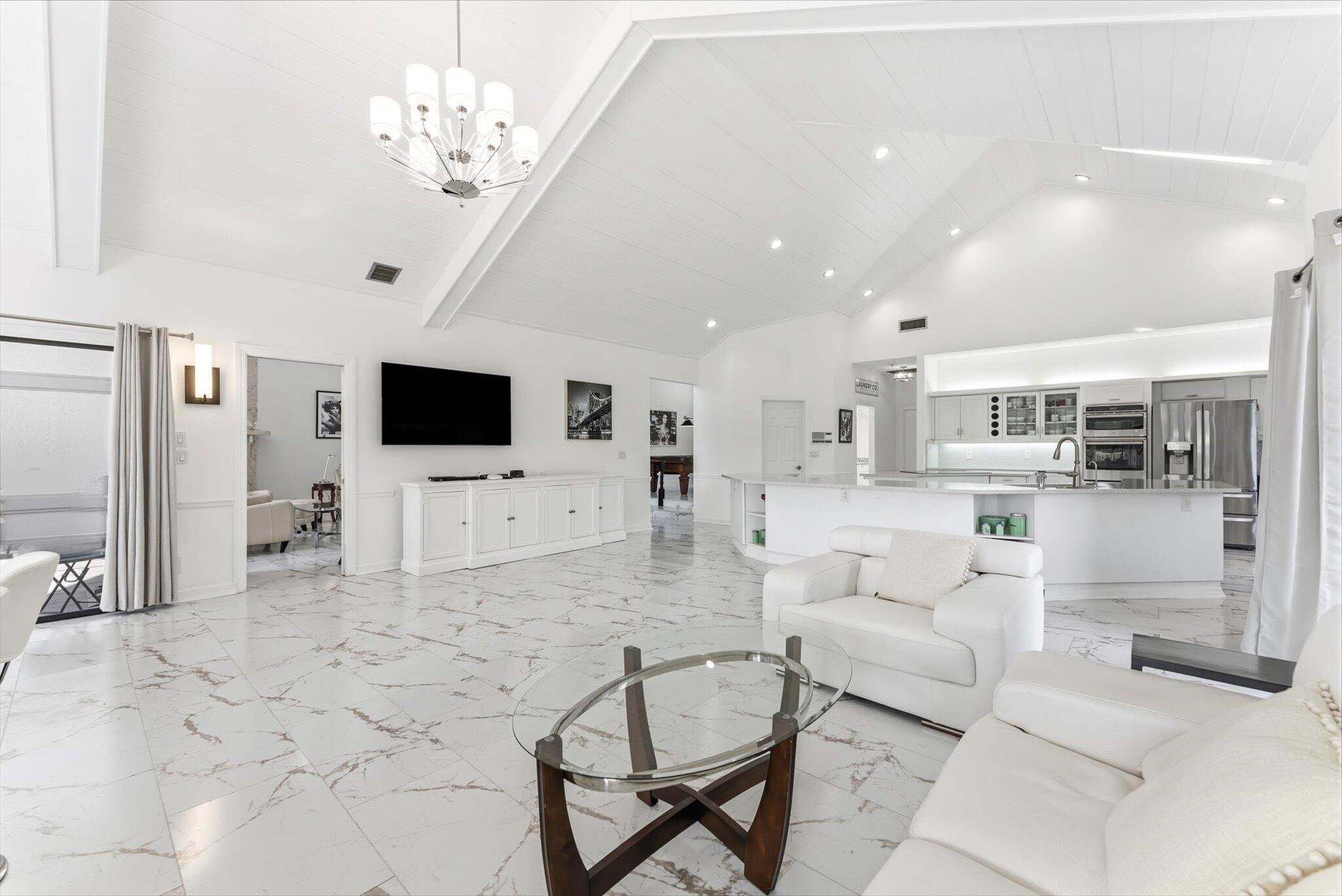 10722 Kirkaldy Lane Boca Raton, FL 33498 - Photo 9 of 76 a living room with furniture and a flat screen tv