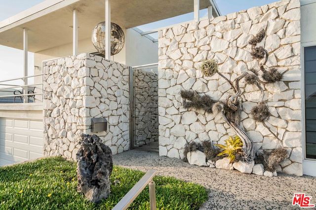 a bathroom with a toilet and a shower curtain