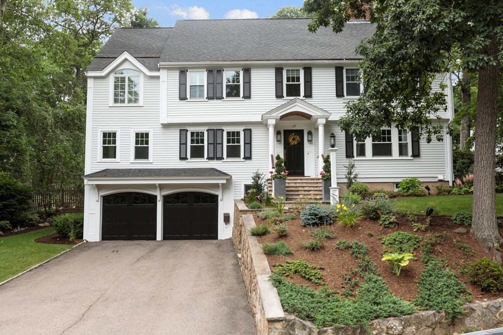 69 Fox Hill Road Wellesley, MA 02481 - Photo 1 of 30 a front view of a house with a yard and garage