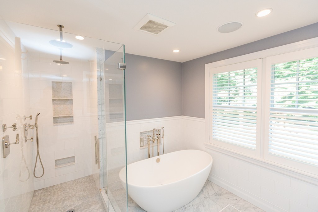 69 Fox Hill Road Wellesley, MA 02481 - Photo 15 of 30 a bathroom with a white bath tub sitting next to a window
