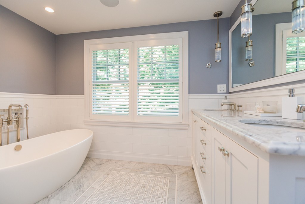 69 Fox Hill Road Wellesley, MA 02481 - Photo 16 of 30 a bathroom with a granite countertop sink and a bathtub