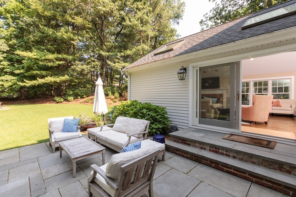 69 Fox Hill Road Wellesley, MA 02481 - Photo 25 of 30 a view of a patio with couches and pool table and chairs