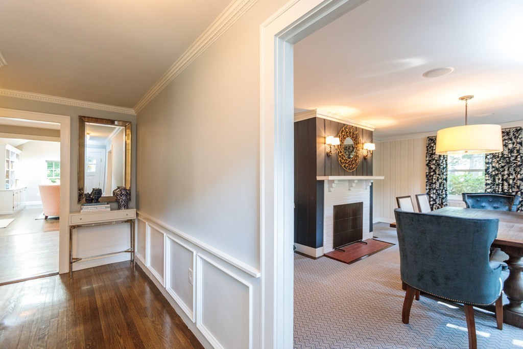 69 Fox Hill Road Wellesley, MA 02481 - Photo 3 of 30 a view of a livingroom with furniture a fireplace and wooden floor