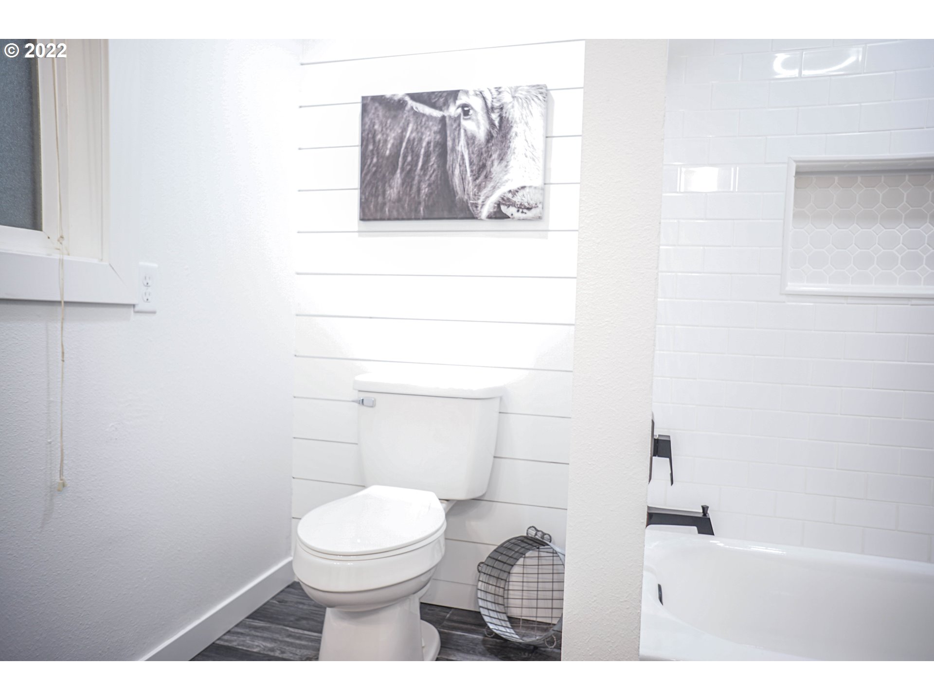 6199 Thurston Road Springfield, OR 97478 - Photo 27 of 28 a bathroom with a toilet and a picture