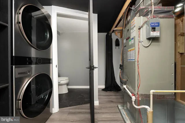 a view of a storage and utility room with a washer dryer