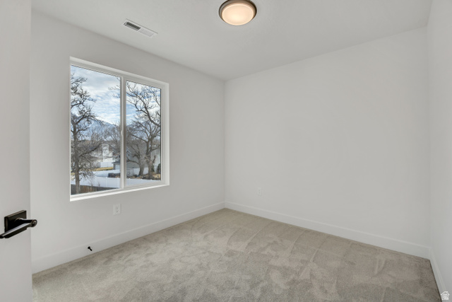 330 East 7635 S Street Sandy, UT 84047 - Photo 19 of 29 Carpeted empty room featuring baseboards