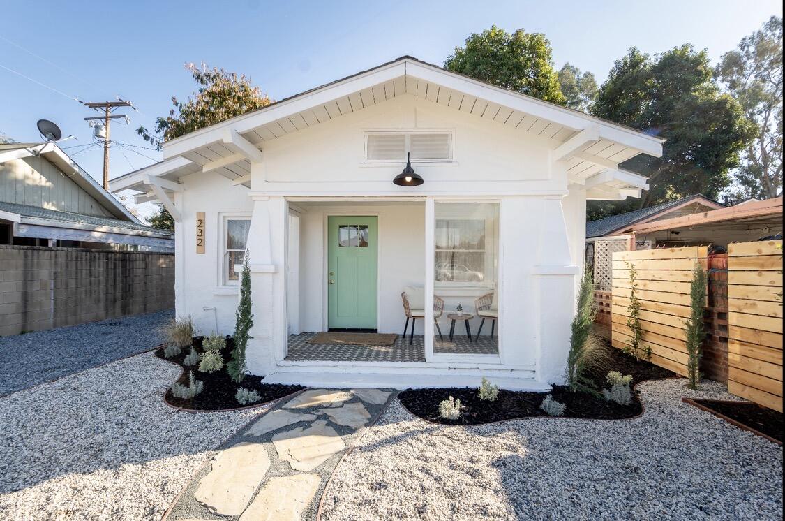 232 Ash Street Exeter, CA 93221 - Photo 2 of 13 a front view of a house with garden