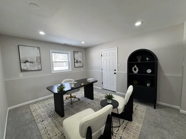 a living room with furniture a table and wooden floor