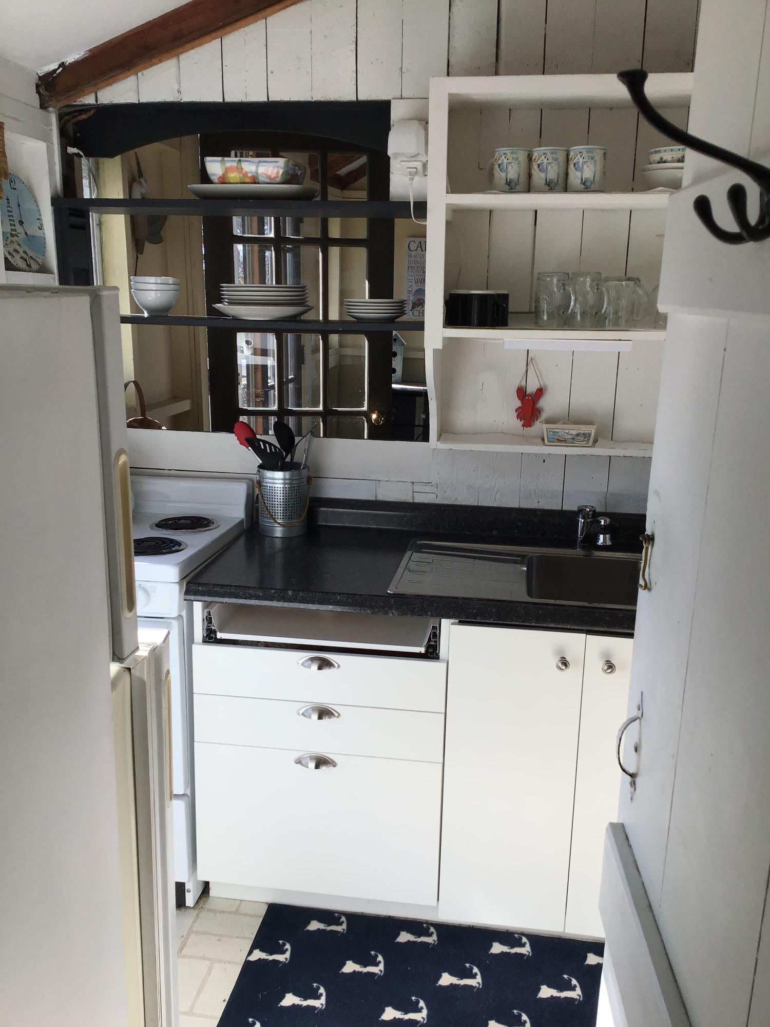 10 Lower County Road Dennis Port, MA 02639 - Photo 23 of 25 a kitchen with a sink and cabinets