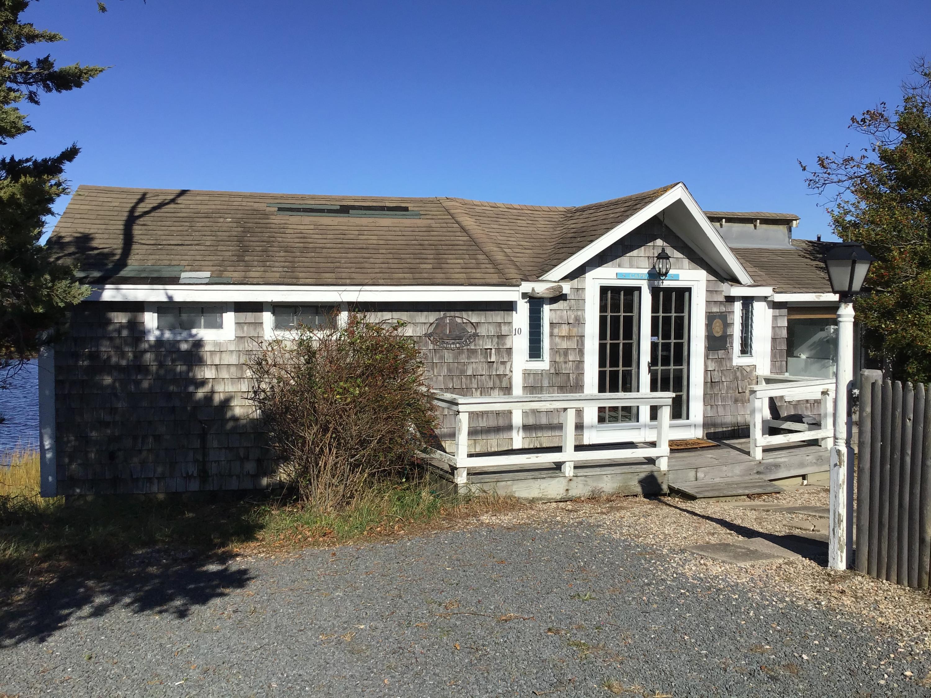 10 Lower County Road Dennis Port, MA 02639 - Photo 3 of 25 a view of a house with a outdoor space