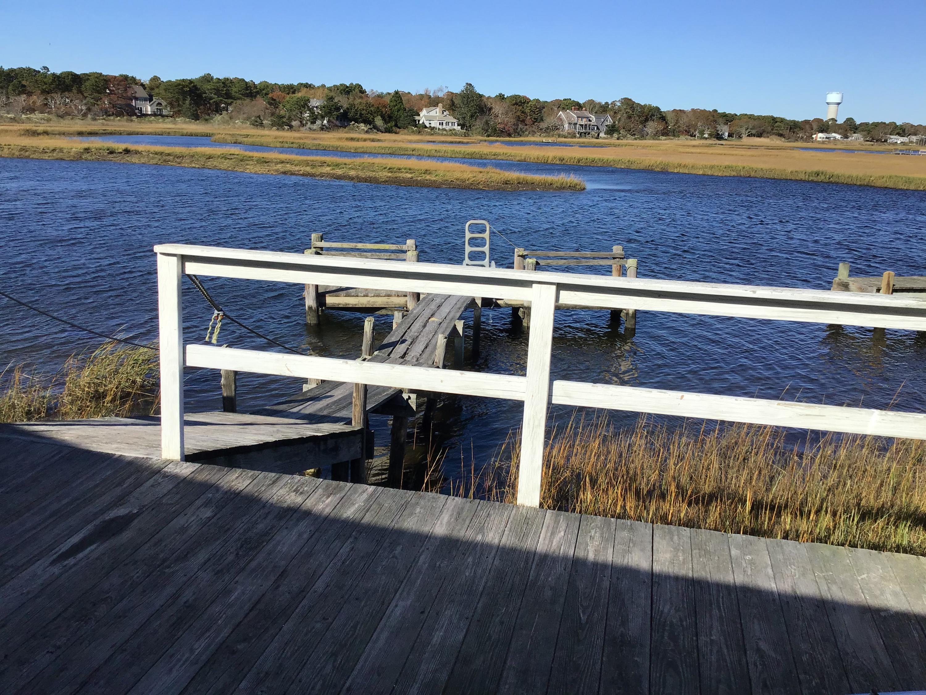 10 Lower County Road Dennis Port, MA 02639 - Photo 5 of 25 a view of a lake with a mountain