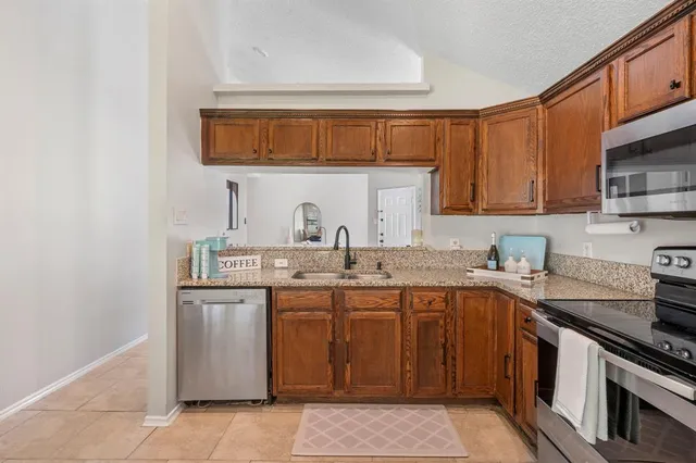 a dining room with furniture and a window