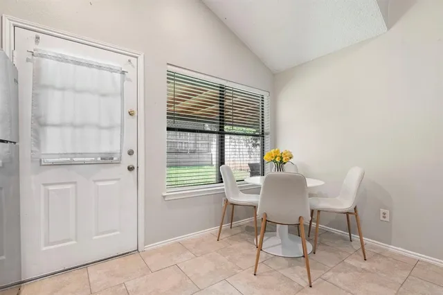 a bedroom with bed and window