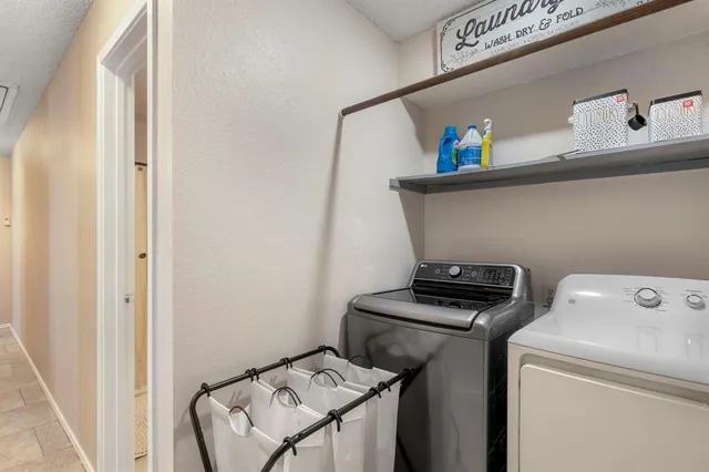 a utility room with dryer and washer