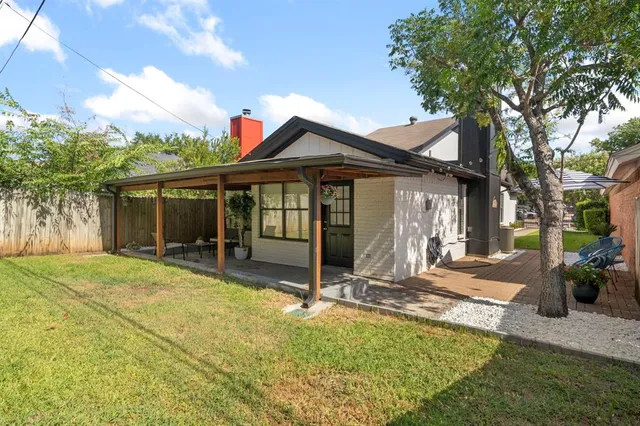 a swimming pool with outdoor seating and yard