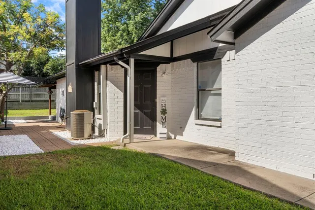 a living room with fireplace furniture and a flat screen tv