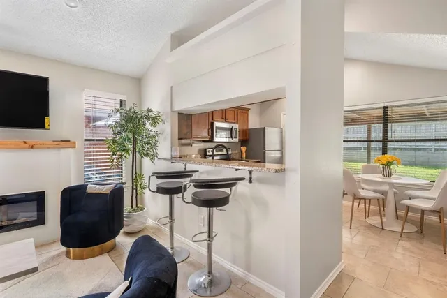a kitchen with a refrigerator sink and stove