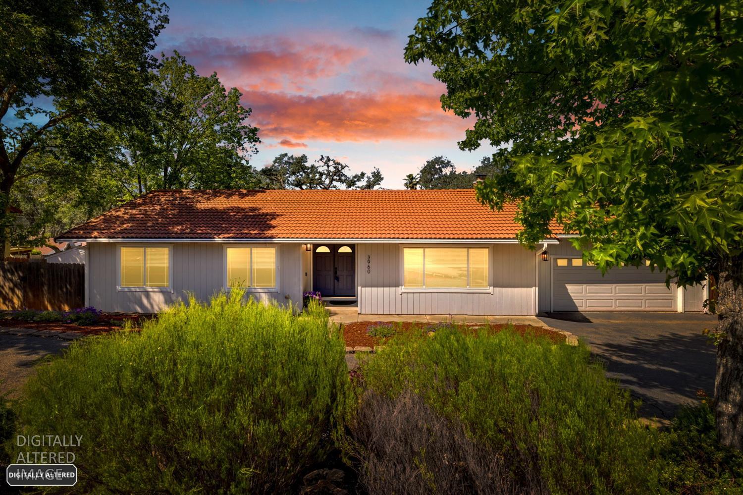 3960 Rustic Road Cameron Park, CA 95682 - Photo 1 of 1 a front view of a house with garden