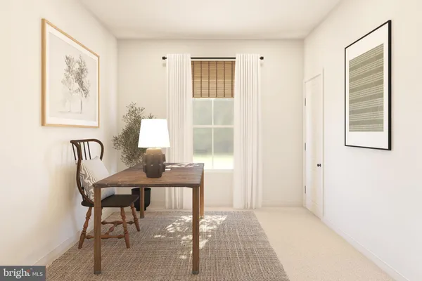 a workspace with furniture and window