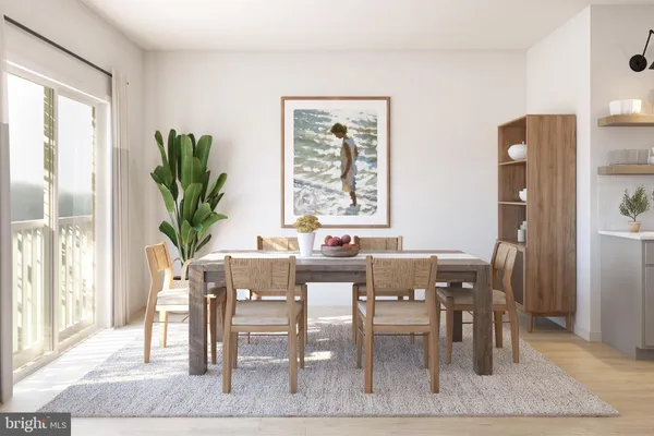a view of a dining room with furniture and a potted plant