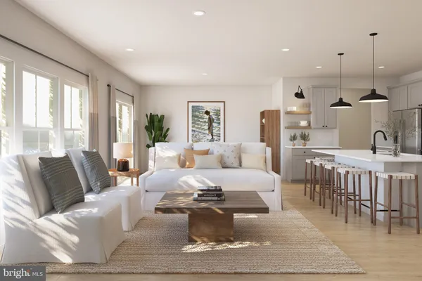 a living room with furniture a large window and a dining table