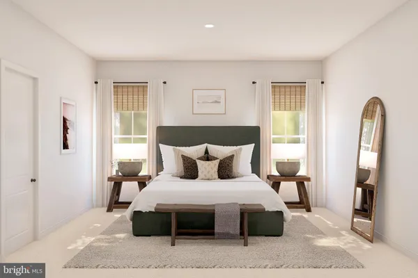 a bedroom with a large bed and a window