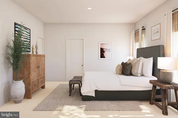 a bedroom with a bed and a couch